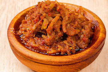 sambal ikan teri or anchovy chili is type of traditional cuisine from Indonesia. Indonesian chili sauce. Sambal ikan teri shoot on White Background. Negative Space. 