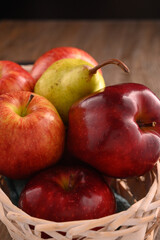 Fototapeta na wymiar Apples and pears fruits macro in basket.