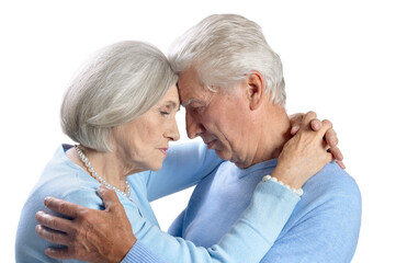 Portrait of sad senior couple on white background