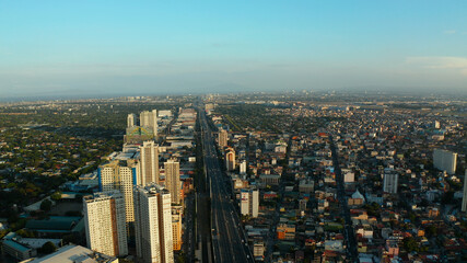 Fototapeta na wymiar The city of Manila, the capital of the Philippines. Modern metropolis, top view. Modern buildings in the city center.