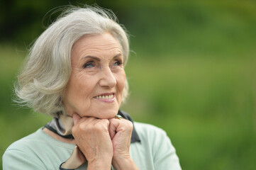 portrait of senior beautiful woman in spring park