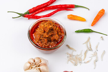 sambal ikan teri or anchovy chili is type of traditional cuisine from Indonesia. Indonesian chili sauce. Sambal ikan teri shoot on White Background. Negative Space. 