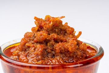sambal ikan teri or anchovy chili is type of traditional cuisine from Indonesia. Indonesian chili sauce. Sambal ikan teri shoot on White Background. Negative Space. 