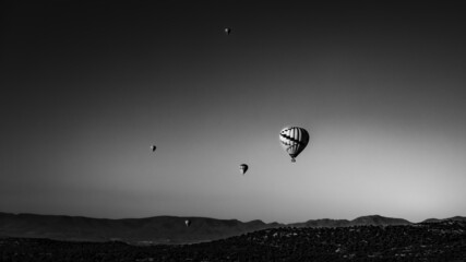 hot air ballooning in black and white