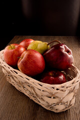 Apples and pears fruits macro in basket.
