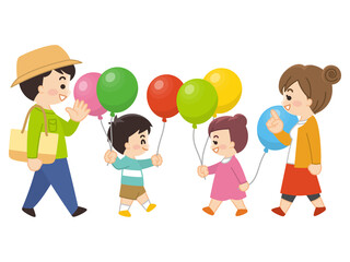 風船を持って散歩している家族