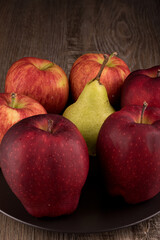 Red apple fruits macro on kitchen table.