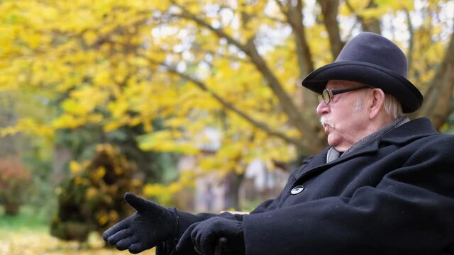 The Old Man Calls His Friend To Him With A Wave Of His Hand