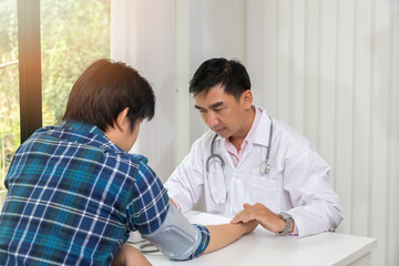 Fototapeta premium Doctor examining patient pulse by hands. Healthcare and medical service.