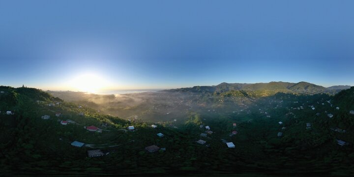 360 panorama mountain village at sunset, fog in the mountains