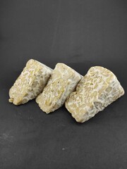 Photo of raw tempeh isolated on black background, Not Focus