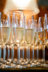 Champagne in the glases on the buffet table, celebration holidays
