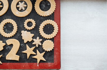 Christmas cookies. Making gingerbread cookies for Holidays. Gingerbread dough. Christmas Baking background. Form for cutting gingerbread. Merry Christmas and Happy Holidays.