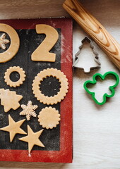 Christmas cookies. Making gingerbread cookies for Holidays. Gingerbread dough. Christmas Baking background. Form for cutting gingerbread. Merry Christmas and Happy Holidays.
