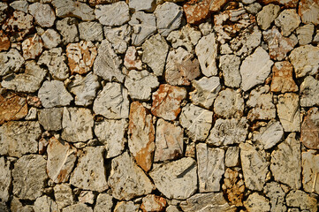Fence from caliche background. Stone pattern.