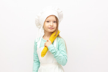 Portrait of a little girl in a white apron holding spaghetti, isolated on white background