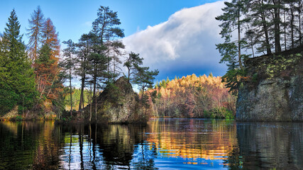 The Aigas Gorge and the River Beauly in Autumn colours with reflections in the calm water
