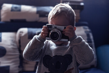 Hungary 2021 November: 2 years old kid using camera at home