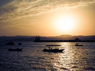 Fototapeta na wymiar Scenic view at sunset from Aqaba Port , Jordan. Sunset on the Red Sea