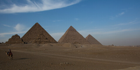 Fototapeta na wymiar The great pyramid of Giza, Egypt, stands between 2 other pyramids
