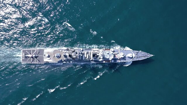 Aerial view of naval ship, battle ship, warship, Military ship resilient and armed with weapon systems, though armament on troop transports. support navy ship. Military sea transport.