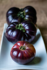Tomatoes of the new variety Mar Azul, pink and bluish when ripe, and purple when still green.