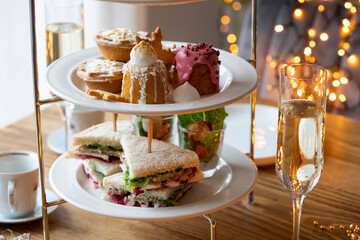 Christmas afternoon tea with mince pies, cakes,  turkey sandwiches and mini crayfish cocktails - obrazy, fototapety, plakaty