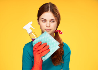 cleaning lady with detergent work yellow background positive