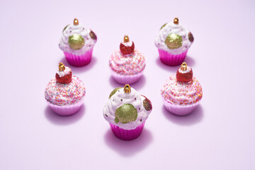 Different Xmas baubles in form of cupcake