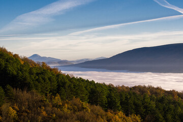 Fototapeta na wymiar hilly mountain landscape with fog at dawn