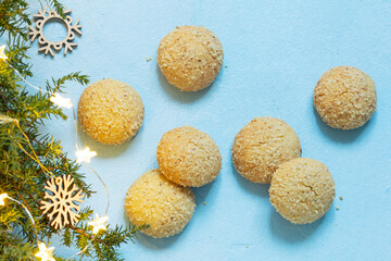 Christmas nut cookies Filbertines on a background of branches, cones and Christmas decorations.