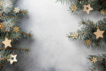 Christmas background with fir twigs on textured background with text space