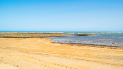 Fototapeta na wymiar Landscape of beautiful sandy great Beach in Chipiona town, Cadiz, Andalusia, Spain