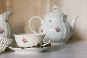 Breakfast tea served with fine china porcelain set with roses