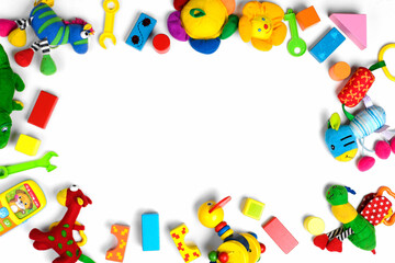 Fototapeta na wymiar Baby toys frame. Colorful kids toys on white background. Copy space for text. Top view. Flat lay.