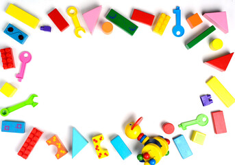 Baby toys frame. Colorful kids toys on white background. Copy space for text. Top view. Flat lay.