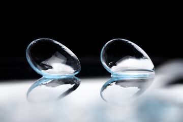 contact lenses on dark background close up view   - Image