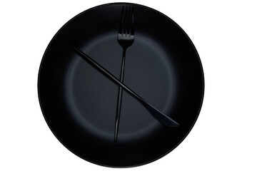 Fork and knife on black plate, representing a clock. White background.