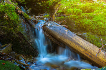 small waterfall on mountain river