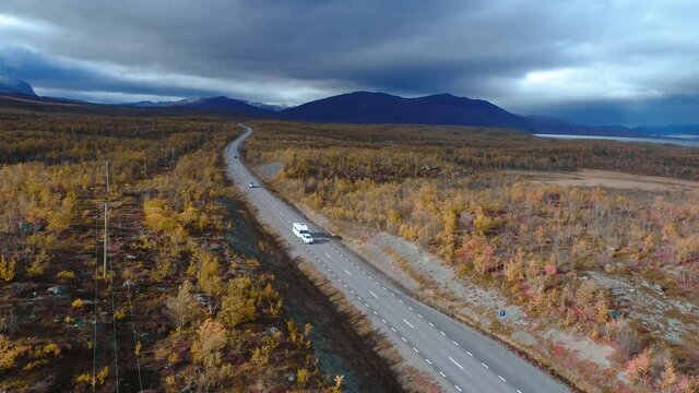 50fps drone footgage Car Camping Caravan driving road lake Swedish Lapland Sunny fall colors Abisko National Park Sweden