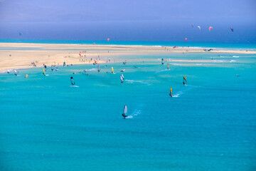 Fototapeta na wymiar Aerial view of Sotavento beach with sailboats during the World Championship on the Canary Island of Fuerteventura.