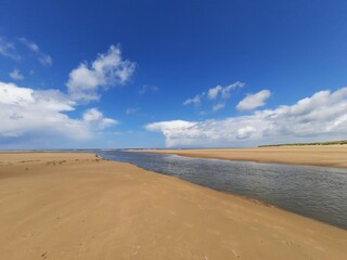 sandy beach with river
