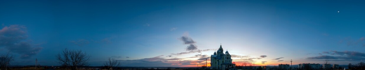 Colorful sunrise over the church in summer
