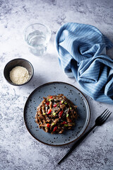 Spicy roasted eggplant with pepper in a dish