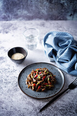 Spicy roasted eggplant with pepper in a dish