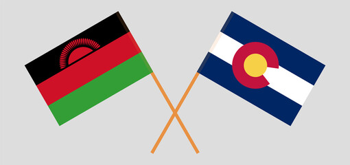 Crossed flags of Malawi and The State of Colorado. Official colors. Correct proportion