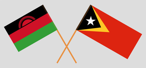 Crossed flags of Malawi and East Timor. Official colors. Correct proportion