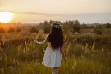 pregnant woman looking at the sunset