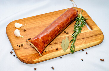 Tasty sausages and vegetables isolated over solid background