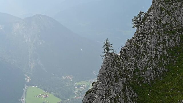 A flying tandem paraglider at the Jenner mountain near Berchtesgaden, Germany.